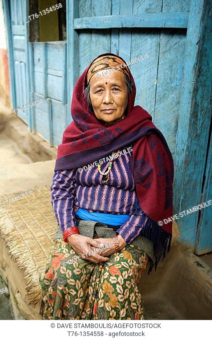 old woman in the village of Bulbule along the Marsyangi River in the Annapurna region of Nepal