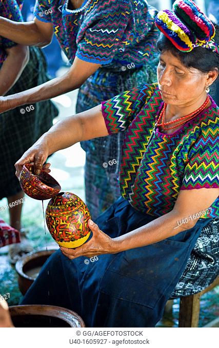 Women serving chilate drink in typical cups, Rabinal achi celebration, Rabinal, Guatemala