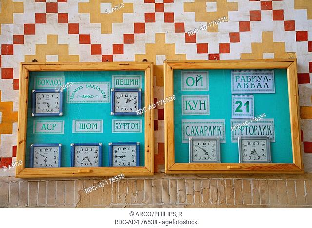 Clocks for time of prayer, entrance of Madrassa, Bukhara, Uzbekistan