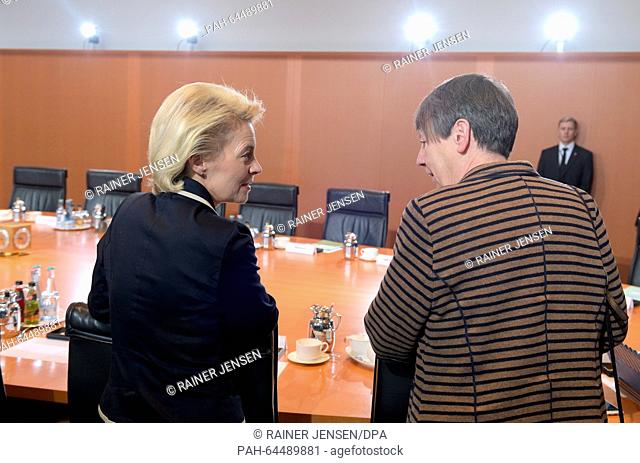 German Minister of Defence Ursula von der Leyen (L) and Enviornmental Minister Barbara Hendricks speak ahead of the last federal cabinet meeting of the year in...