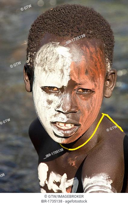 Surma boy with facial and body painting, Kibish, Omo River Valley, Ethiopia, Africa
