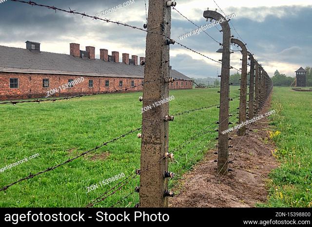 Auschwitz-Birkenau, Poland - May 15, 2019: Buildings of concentration camp Auschwitz surrounded bij barbwire