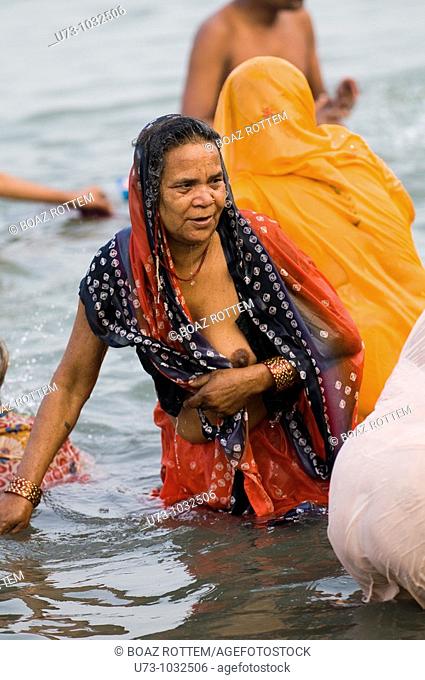 Hindu pilgrims bath in the holy water of Gangasagar island. ( The meeting poing of the Ganges river and the bay of Bengal )