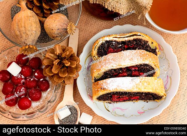 Poppy seed strudel with cherry on the sacking