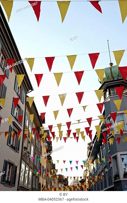 Clothes of carneval revellers in Laufenburg, street decoration, little flags, Baden-Wurttemberg, Germany