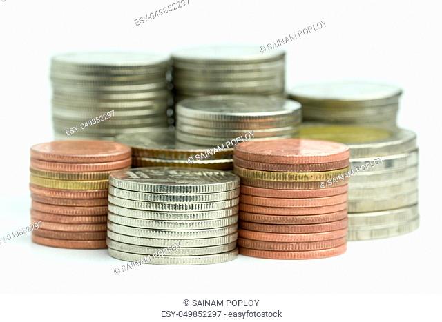 Closeup the coins are stacked neatly on a white background. Suitable for use in business or financial articles
