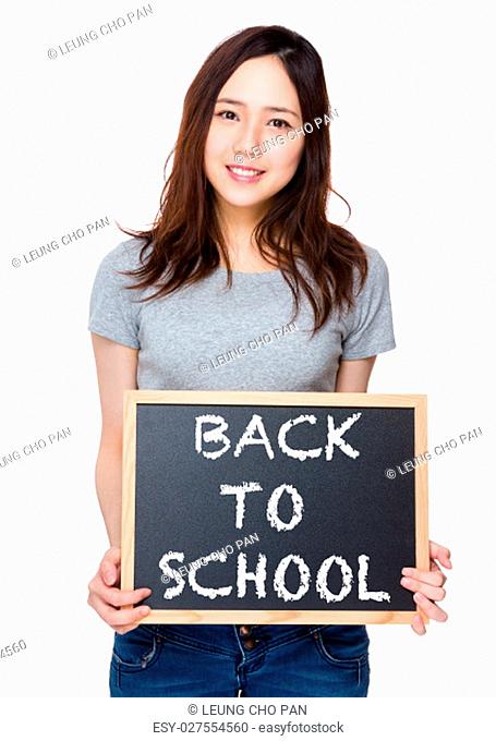 Woman hand hold with blackboard and showing phrase of back to school