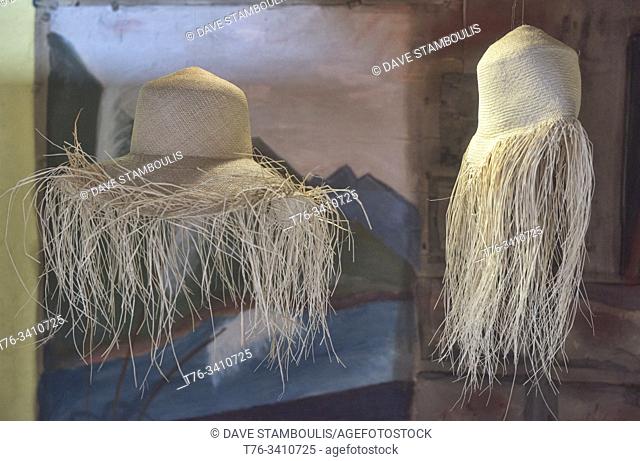 Weaving straw into Panama hats (paja toquilla), which actually come from Ecuador