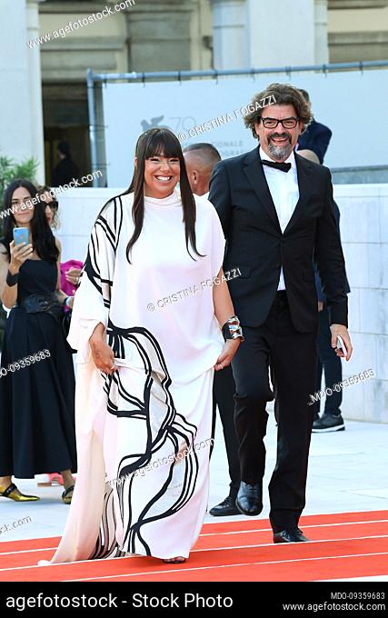 Italian entrepreneur Cristina Fogazzi (Cynical Beautician) with her husband Massimo Portulano at the 79th Venice International Film Festival
