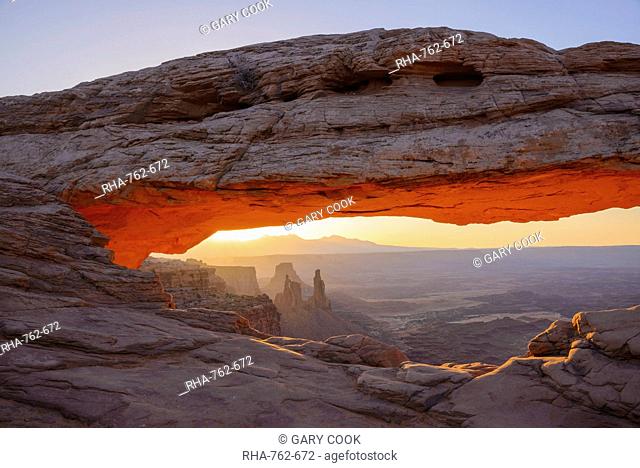 Mesa Arch at dawn looking towards Washerwoman Arch, Islands in the Sky section of Canyonlands National Park, Utah, United States of America, North America