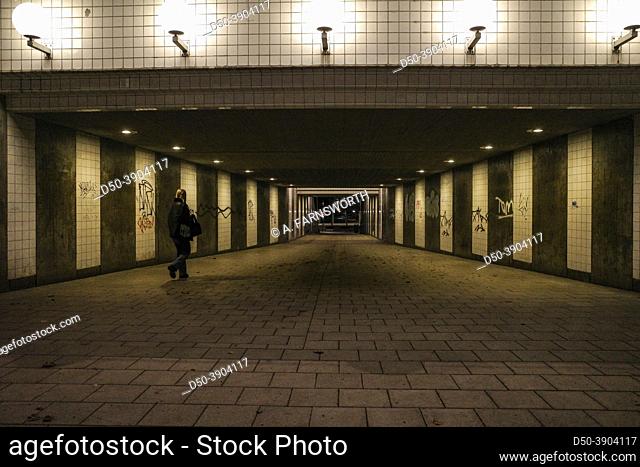 Stockholm, Sweden A person walking in an underground tunnel at Skanstull