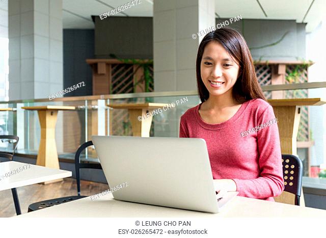 Smiling woman browsing the internet