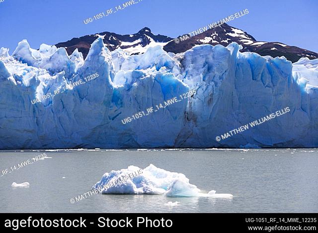 Melting glacier due to global warming and climate change causing environmental impact at Perito Moreno Glacier, Los Glaciares National Park, El Calafate