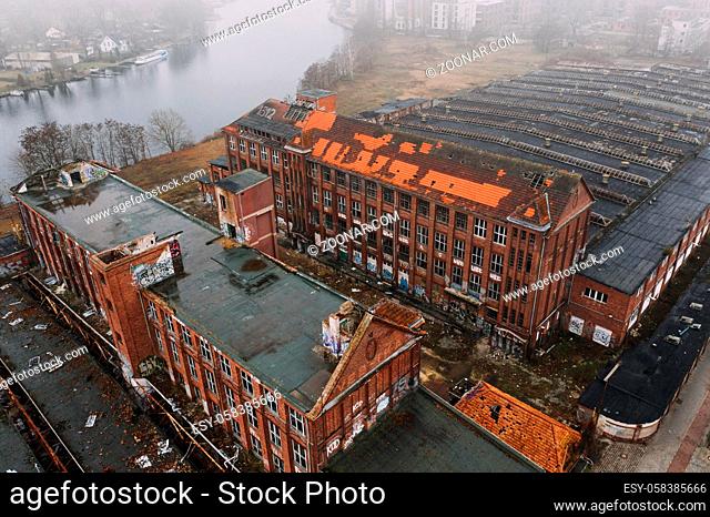 aerial drone view on abandoned old industrial building in foggy cloudy wheater, Berlin Kopenick Kodak Areal Filmfabrik Glanzfilm