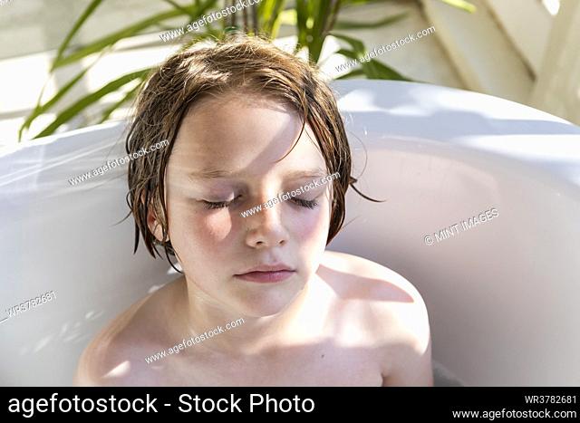 8 year old boy in bathtub