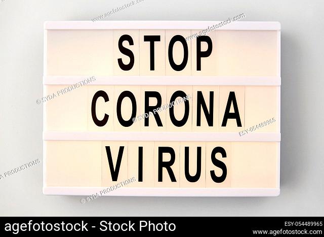 lightbox with stop coronavirus caution words