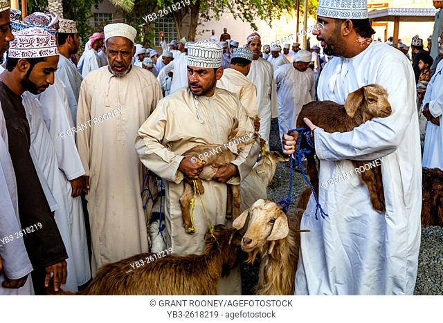 Local Men Selling Goats At The Friday Livestock Market, Nizwa, Ad Dakhiliyah Region, Oman