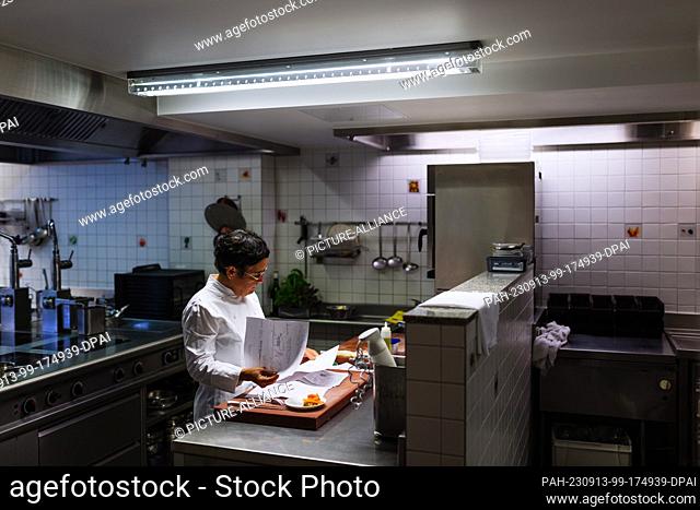 PRODUCTION - 31 August 2023, Baden-Württemberg, Sulzburg: Douce Steiner stands in the kitchen of her two-star Hirschen restaurant