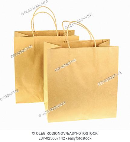 Empty brown recycled paper shopping bags isolated on white background. Side view