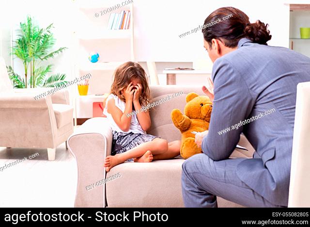 The child psychologist attending small girl