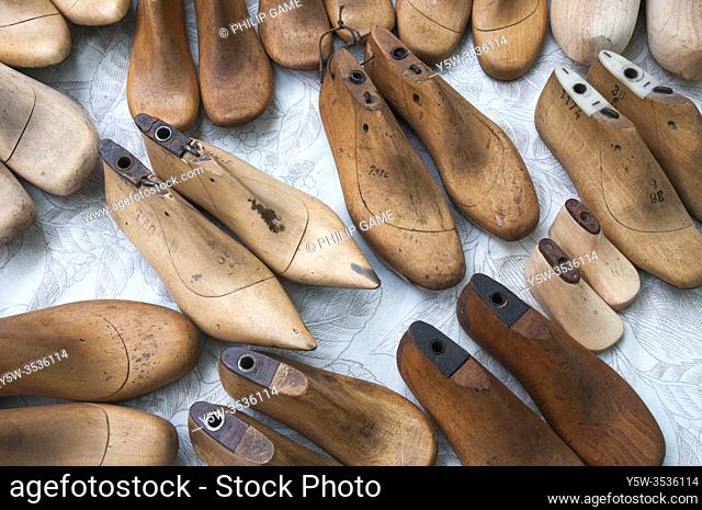 Wooden shoe lasts for sale at a flea market beside the Dijver canal, Bruges