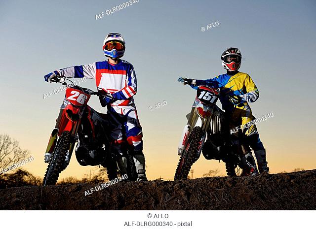 Motocross bikers on dirt track