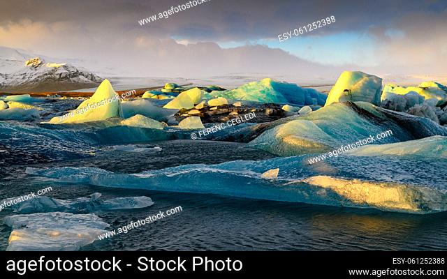 Ice floes in a dramatic sunset color on Jokulsarlon lake, - a famous glacier lagoon in Vatnajokull National Park, Iceland