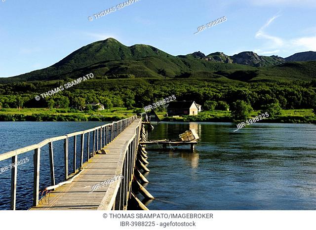 Jetty over the Ozernaya river with a salmon counting station, outflow of Kurile Lake, Kamchatka Peninsula, Russia
