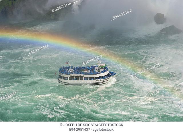 Maid of the Mist boat at Niagara Falls with a rainbow appearing in the mist, Niagara River, Ontario