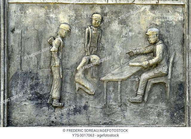 Bas relief at a memorial monument depicting the atrocities of the Khmer Rouge at Wat Samrong Knong near Battambang, Cambodia, South East Asia, Asia