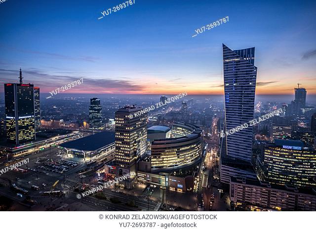 Sunset over Warsaw, Poland. View with Marriott Hotel, Central Railway Station, Golden Terraces mall and Zlota 44 skyscraper