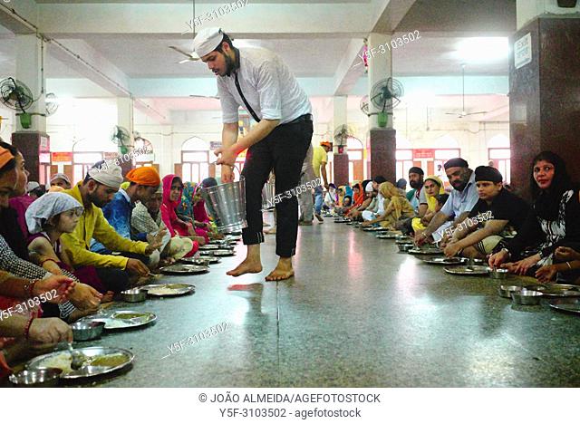 The langar at Golden temple at Amritsar, where 60000 free meals are served everyday, and that mostly relies on volunteers to run it