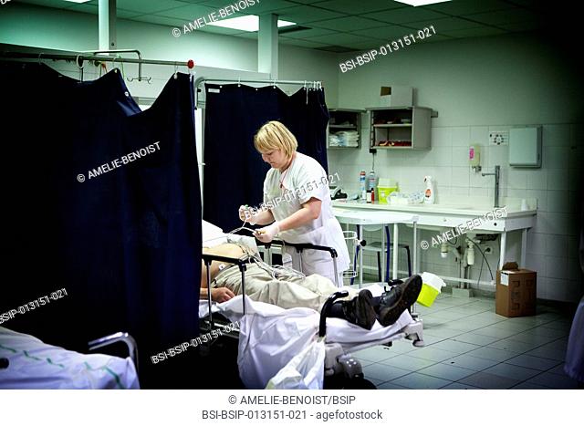 Reportage at night in the A&E department of Robert Ballanger general hospital, France. A nurse in the trauma centre