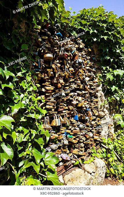 padlocks of fidelity, trust, faithfulness locked to a fence in Tata  As Symbol for forever love lovers lock the padlocks on the fence and throw the key in the...