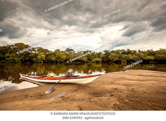 A kayak rests on a sandbar on the Altamaha River