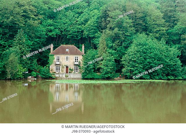 House at a lake in forest near Paimpol (Pempoull). Britanny. France