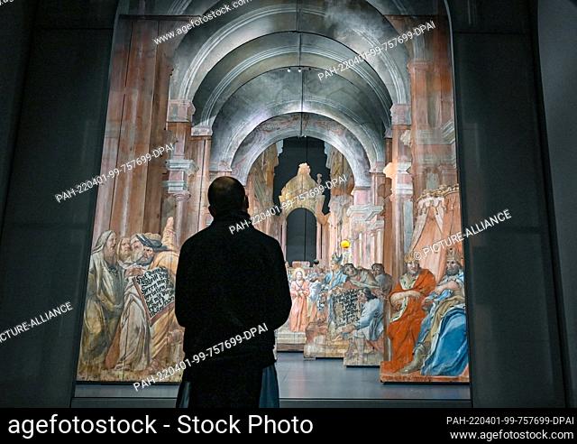 01 April 2022, Brandenburg, Neuzelle: A monk looks at the scenery theater with the scene ""Jesus before Annas"" in the Museum Heavenly Theater in the Neuzelle...