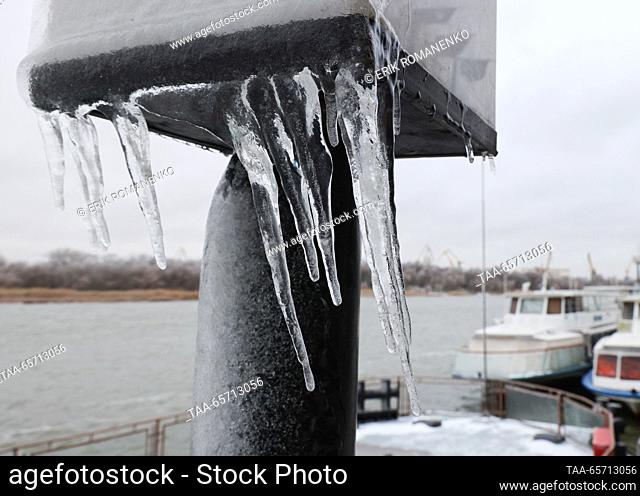 RUSSIA, ROSTOV-ON-DON - DECEMBER 13, 2023: Glaze ice from freezing rain covers the waterfront railing. Strong winds with gusts of up to 18 metres per second and...