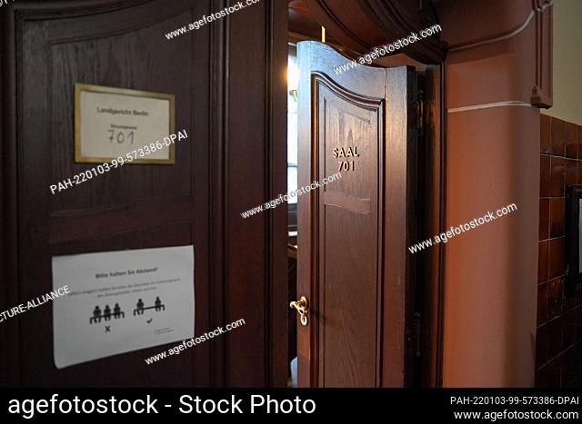 03 January 2022, Berlin: View of the entrance door of room 701 of the Moabit Criminal Court. A 40-year-old woman is accused of having recruited Vietnamese women...