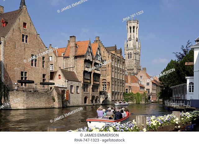 Canal view with a tour launch, Flemish gables and the Belfry tower, Brugge, UNESCO World Heritage Site, Belgium, Europe