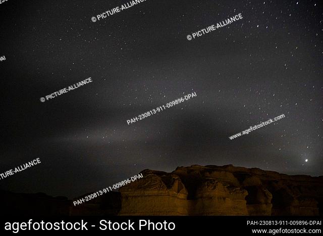 12 August 2023, Egypt, Faiyum: A Picture taken on 12 August shows the Perseid meteor shower over the natural reserve area of Wadi Al-Hitan (Valley of the...
