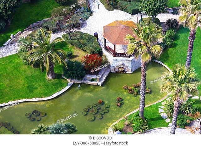 Aerial image of a beautiful tropical garden and a seating area in the center