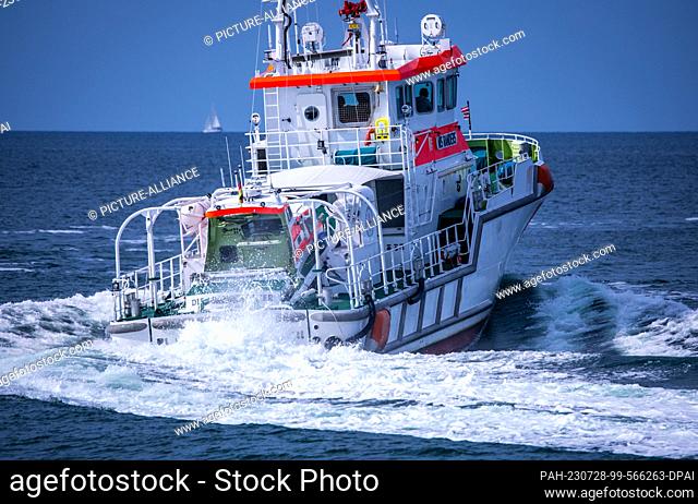 PRODUCTION - 27 July 2023, Mecklenburg-Western Pomerania, Zingst: The 28-meter-long and nearly 4, 000-horsepower sea rescue cruiser ""Nis Randers"" maneuvers...