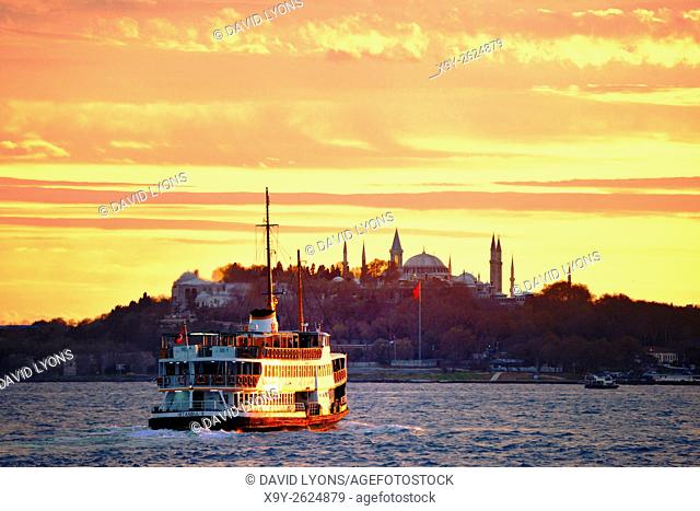 Bosphorus passenger ferry passes Seraglio Point, Topkapi Palace and Hagia Sophia, city centre of Istanbul, Turkey. Looking S. W