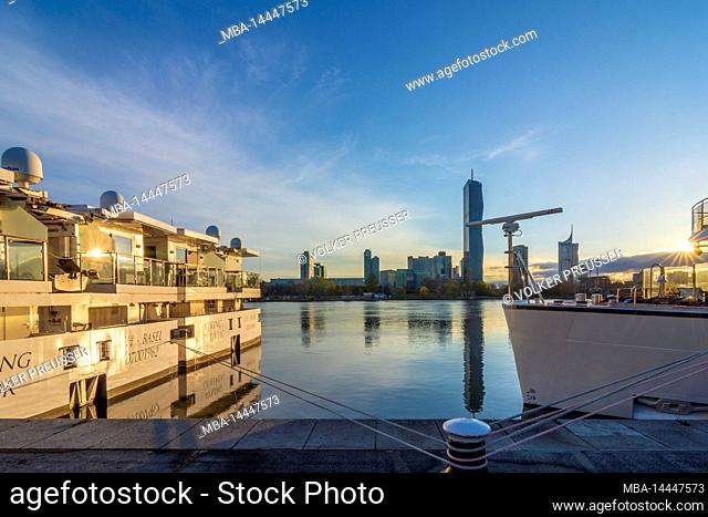 Vienna, sunrise at river Donau, cruise ships, Donaucity with DC Tower 1 in 22. district Donaustadt, Vienna, Austria