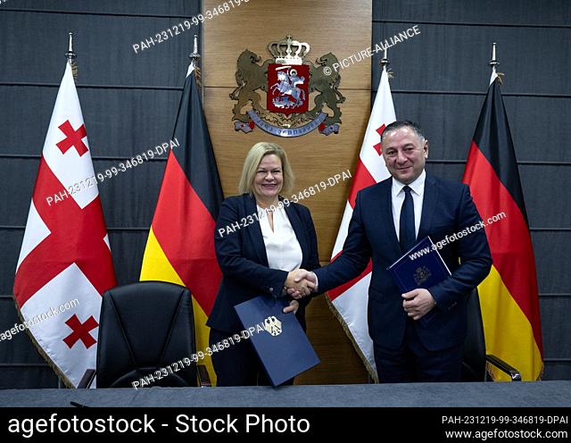 19 December 2023, Georgia, Tiflis: Federal Minister of the Interior Nancy Faeser (SPD, l) and Georgian Interior Minister Vakhtang Gomelauri sign a joint...