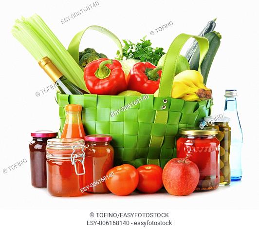 Green shopping bag with groceries isolated on white background