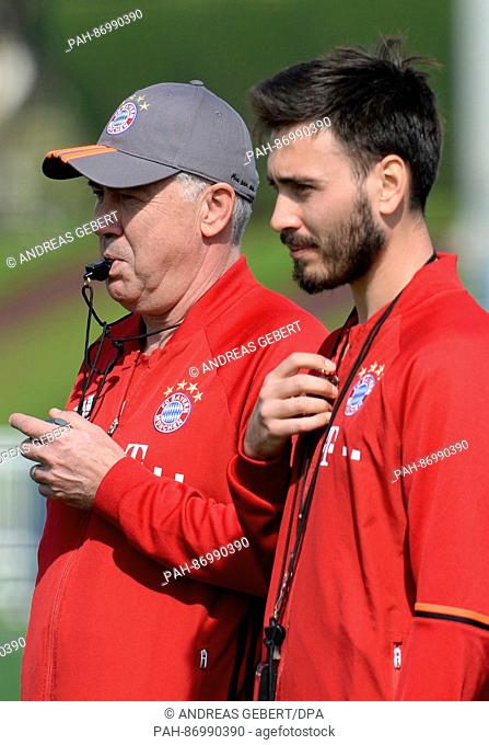 FC Bayern Munich coach Carlo Ancelotti (L) with assistant coach and son Davide Ancelotti during a training session in Doha, Qatar, 05 January 2017