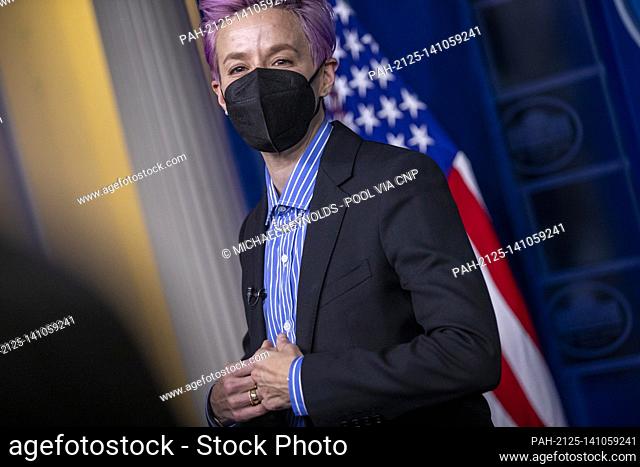 American professional soccer player Megan Rapinoe has her picture taken at the briefing room podium prior to the event to mark Equal Pay Day in the State Dining...