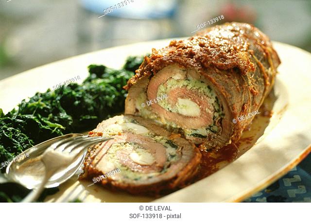 Rolled roast beef stuffed with spinach